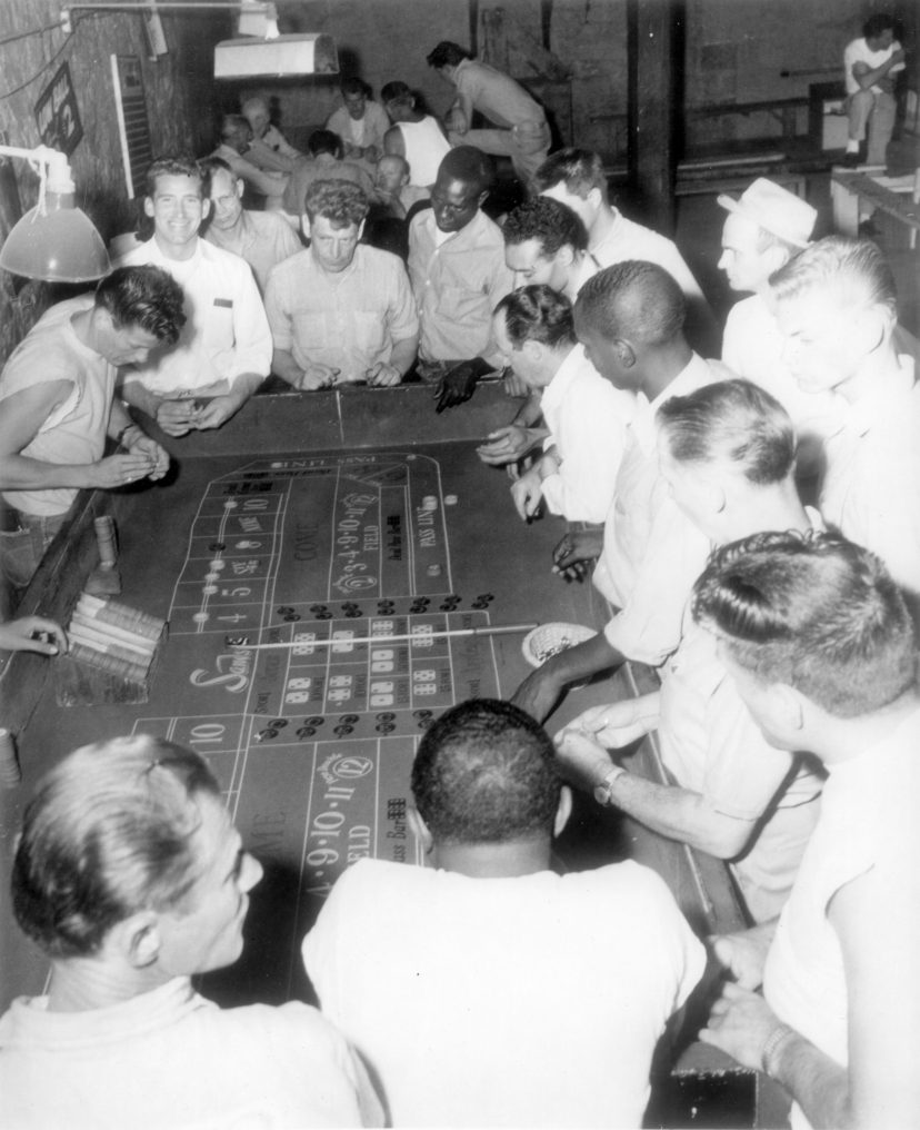 Inmates gathered around a craps table circa1960